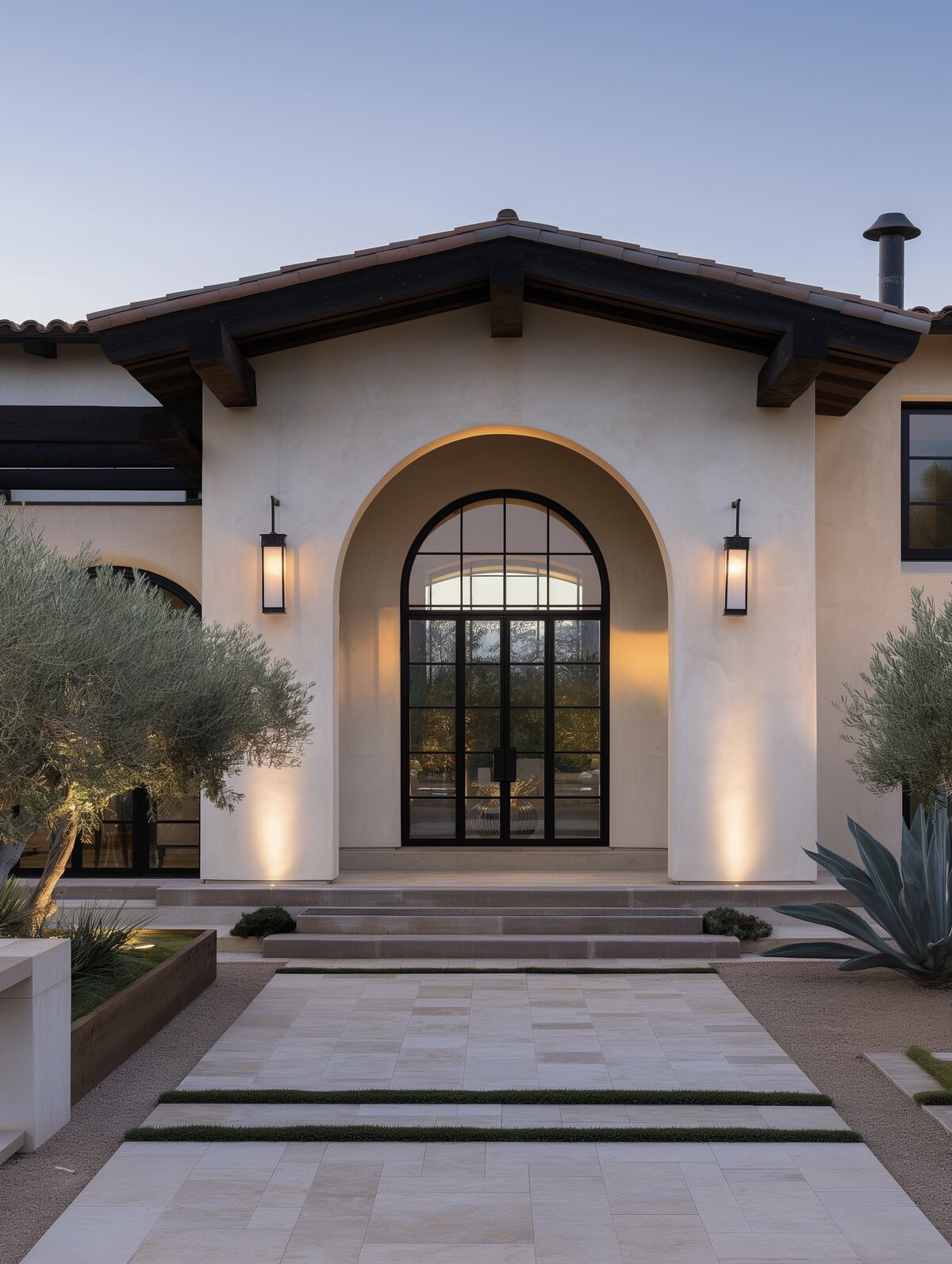 Spanish vintage-inspired Scottsdale terrace with modern lighting and stylish furnishings by The Olari Studio, outdoor living design
