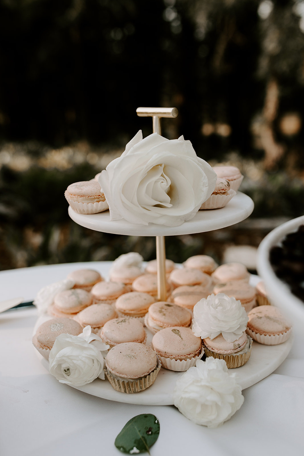 Tahoe Wedding Planners macaroons on 2 tier tray on table with La Tavola Tuscany White linen at venue Mitchell's Mountain Meadows Truckee, Joy of Life Events image by The Shepard Photography