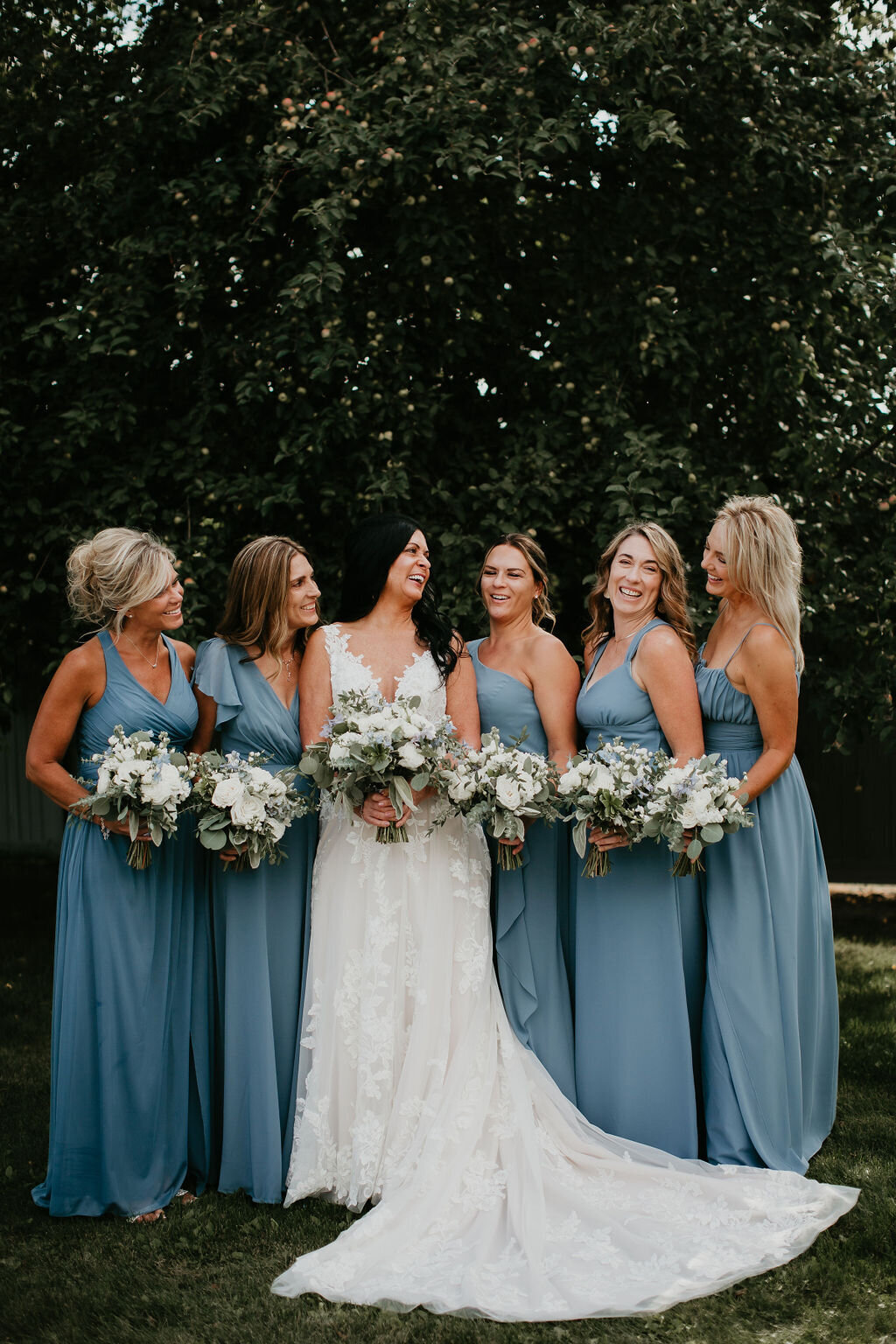 Blue bridesmaids dresses with white flowers