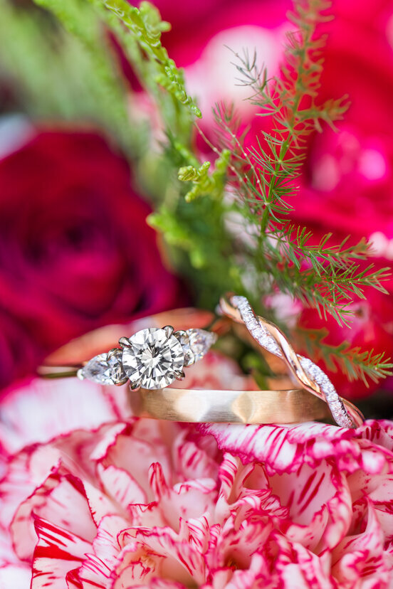 wedding-rings-in-red-flowers