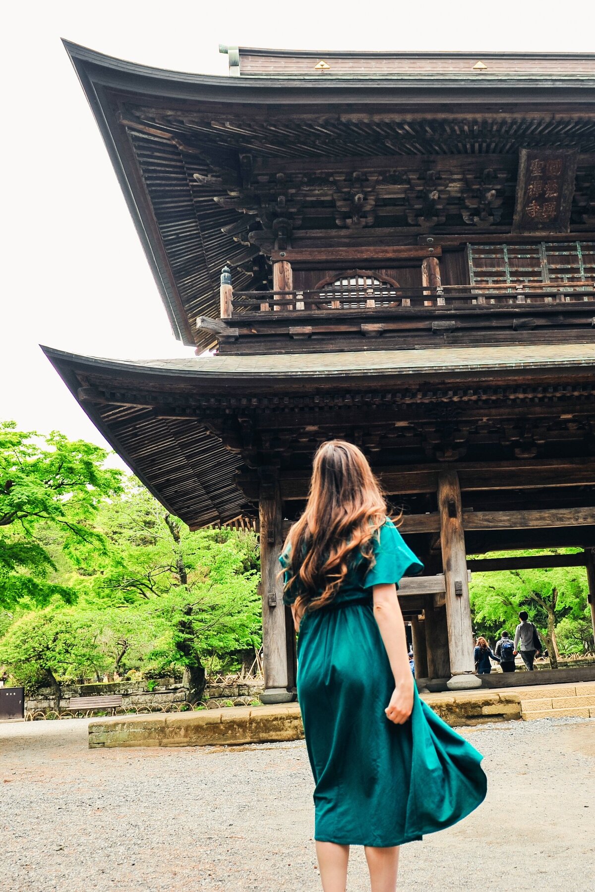kacy beck in a dress at a kamakura temple