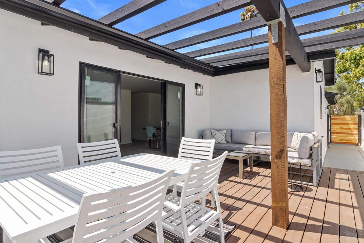 Outdoor-patio-with-seating-area-and-pergola