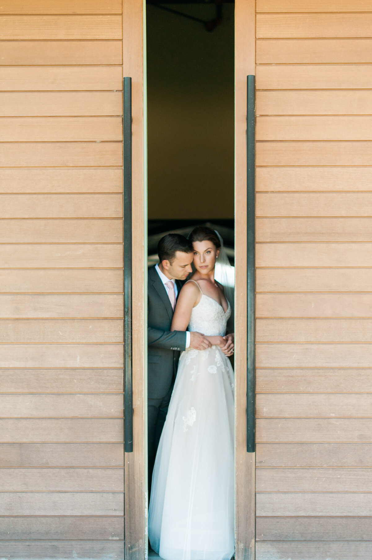 bride and groom portrait at ponzi winery in the big double doors