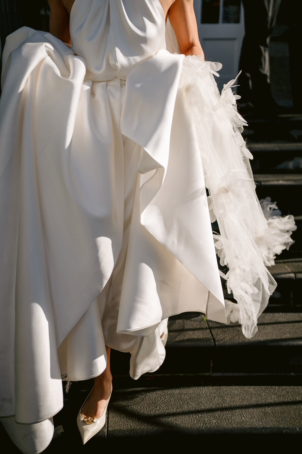 wedding dress close up with valentino shoes.  a fashion wedding photograph