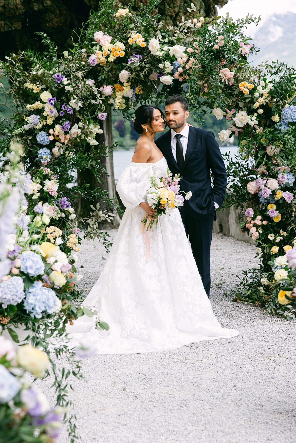 A wedding day photo of the bride and groom at Villa Aura del Lago on Lake Como in Italy