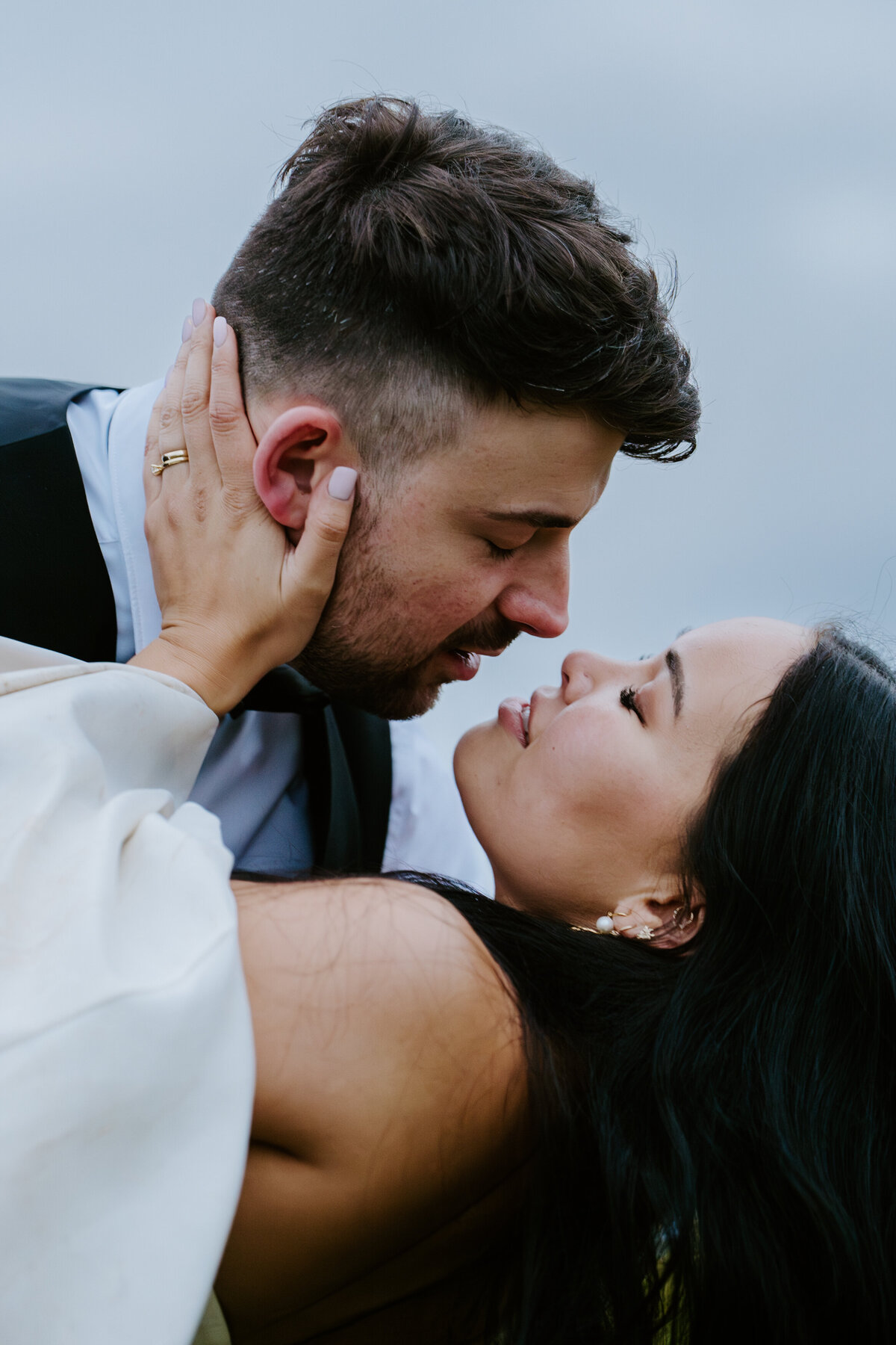 Close-up of bride and groom kissing during Dolomites elopement.