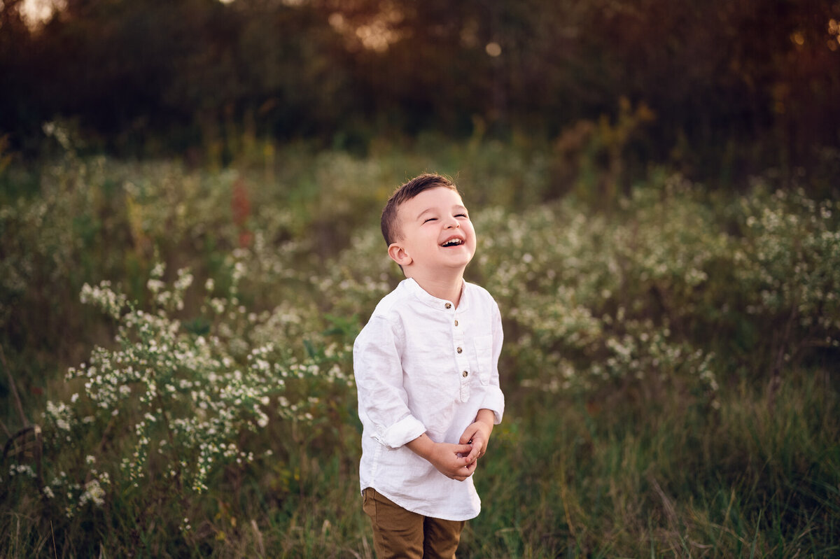 Boy smiling for family photos