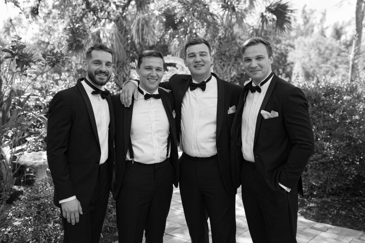 Groomsmen portraits with Tuscan-style backdrop at La Casa Toscana