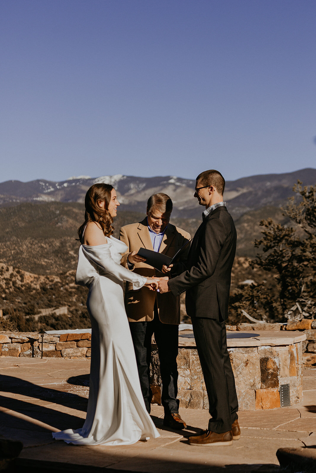 bride and groom having their ceremony in their backyard in Santa Fe, New Mexico