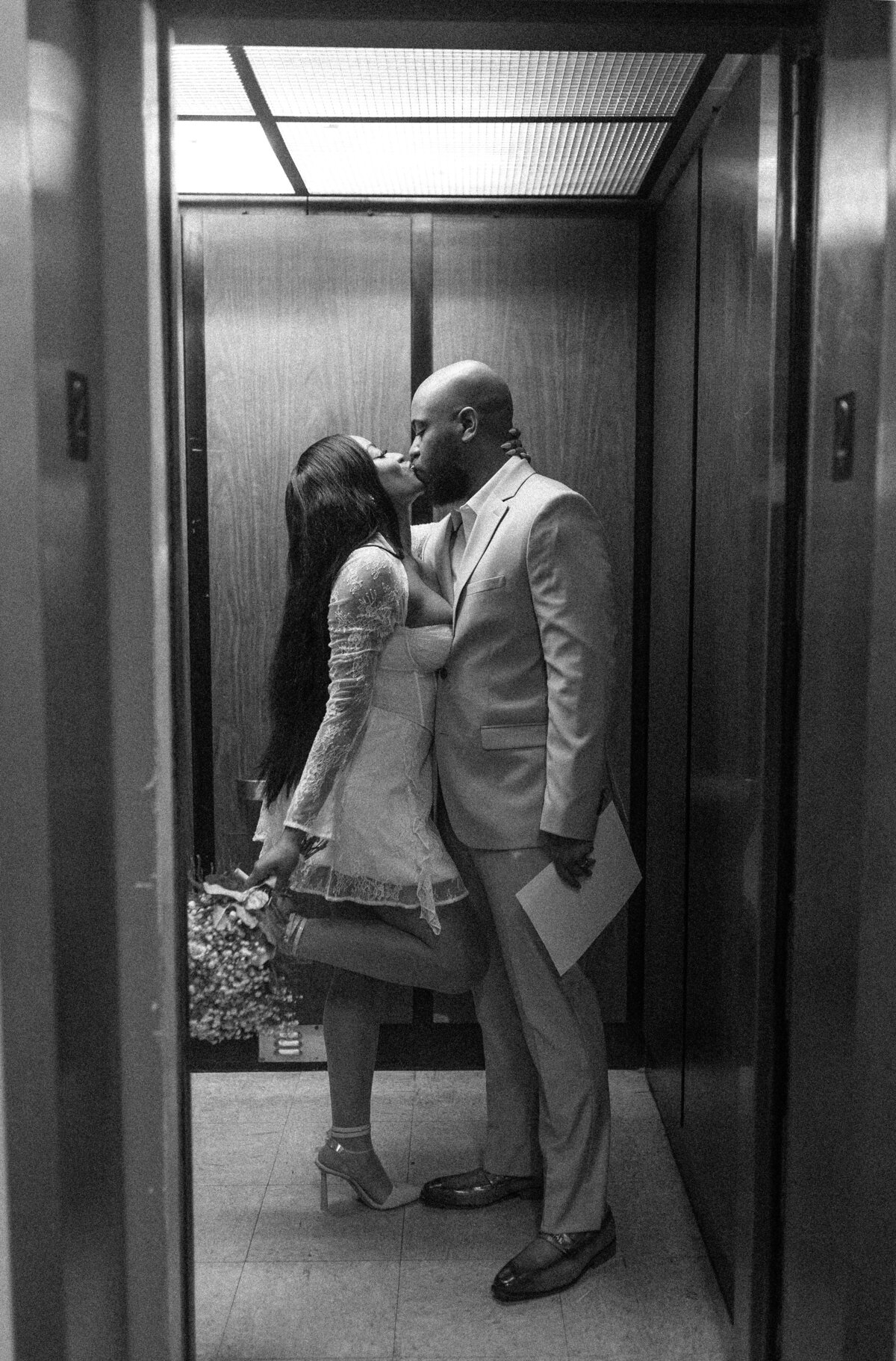 Tallahassee bride and groom standing in an elevator.
