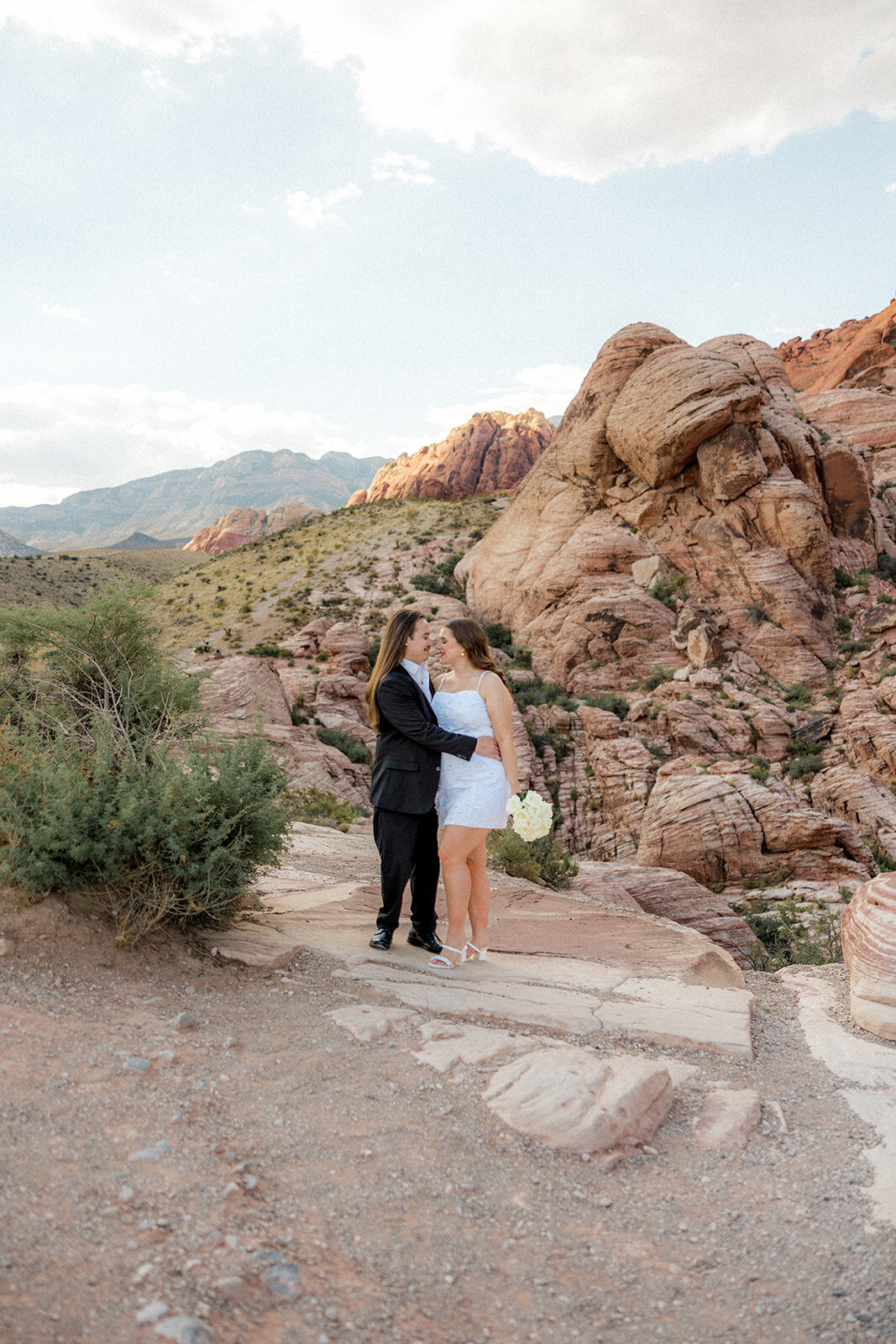 Engaged couples hugging at the Red Rock Canyon