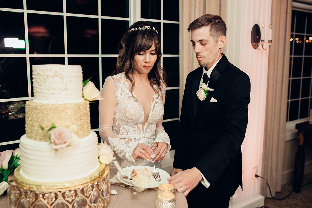 Wedding Photograph Of Bride And Groom Staring At The Cake In Their Plate los Angeles