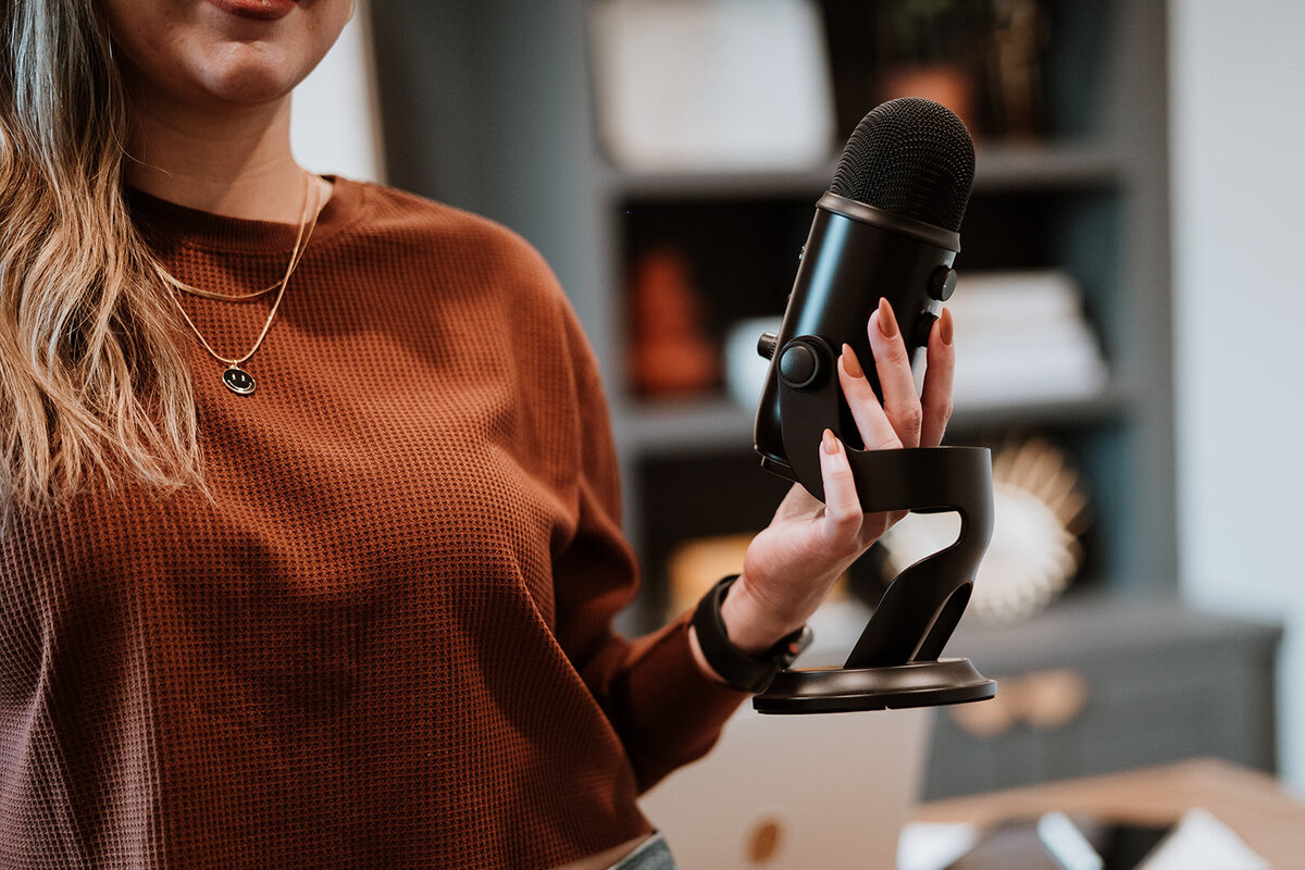 woman holding microphone