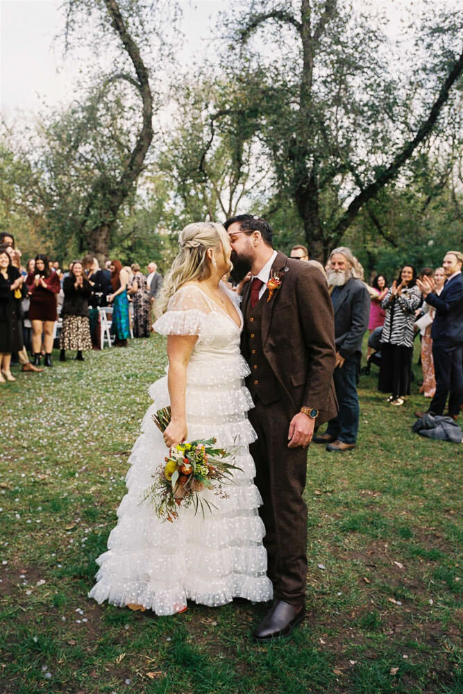 couple kissing on 35mm film after edinburgh gardens ceremony fitzroy melbourne