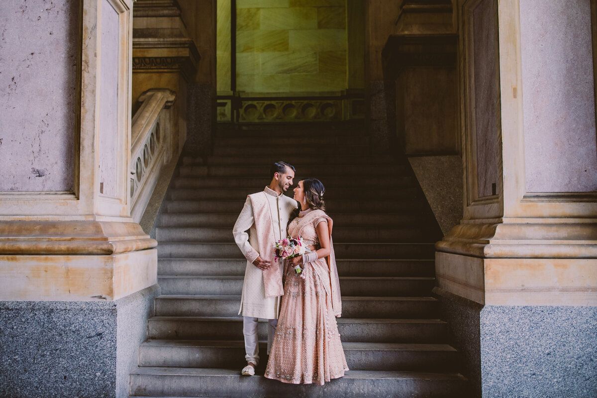 An indian wedding couple sharing a moment at the philadelphia city hall 