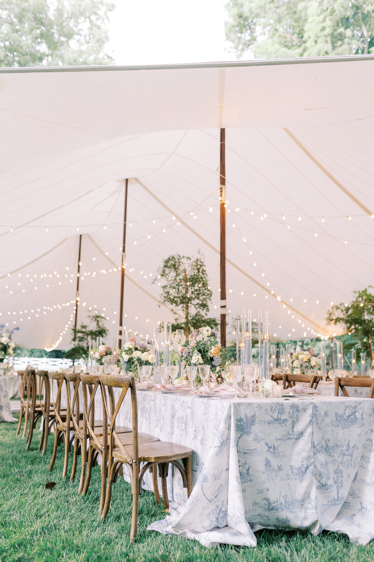 Elegant tulle themed wedding reception with family style seating