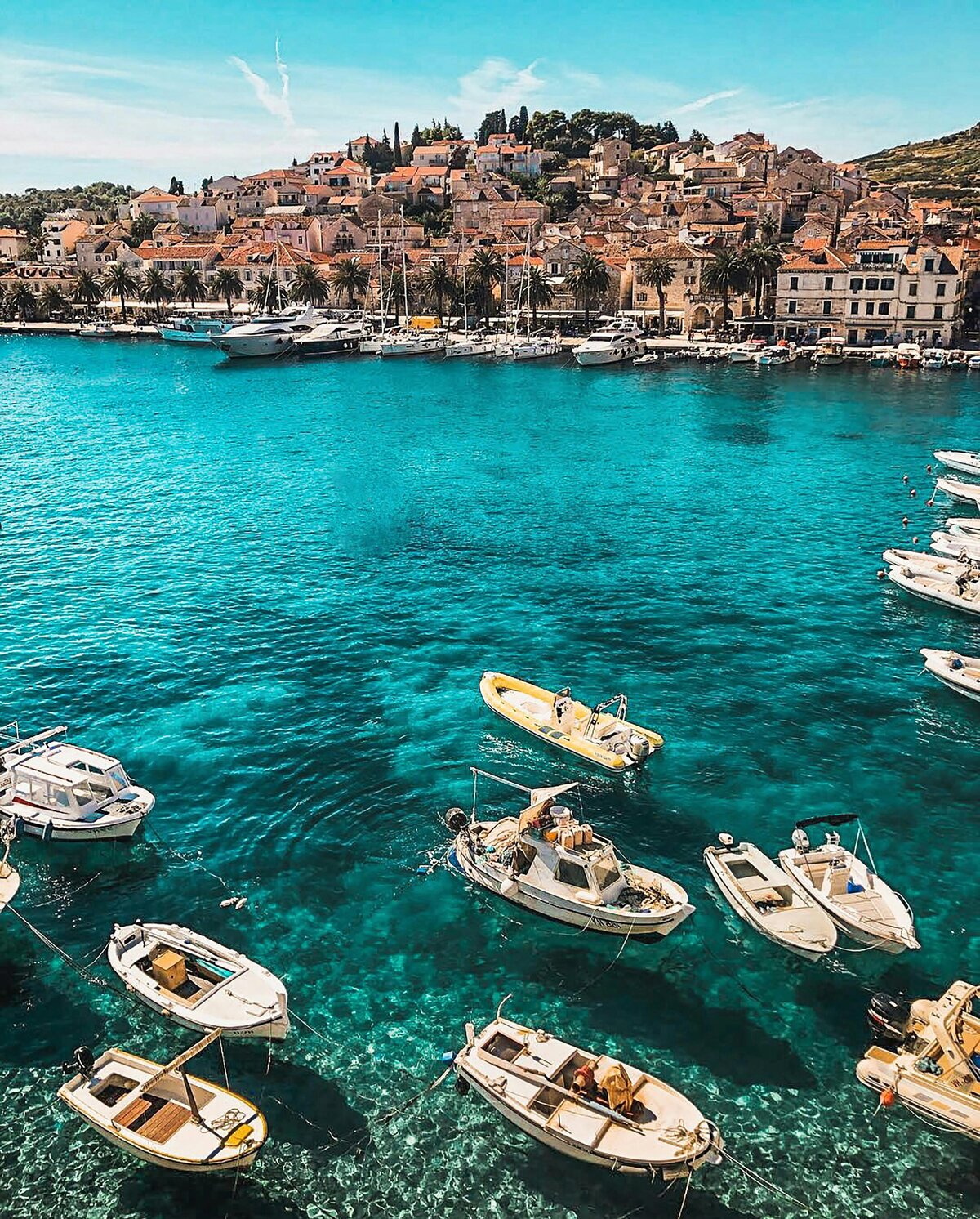 coastal-town-boats-anchored-clear-blue-water