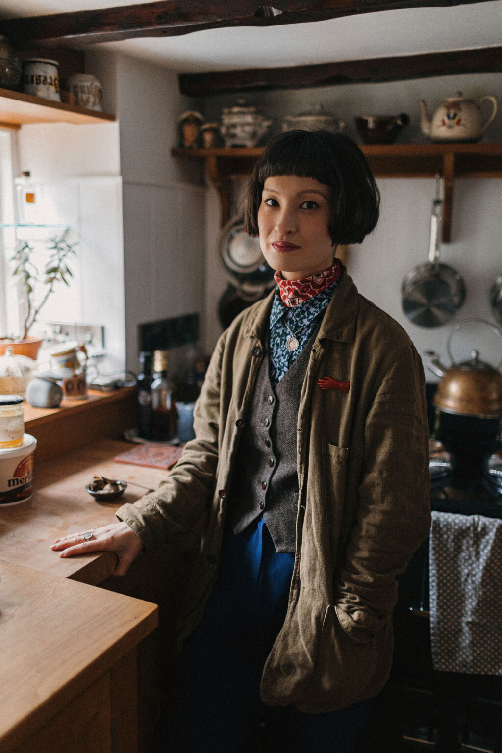 Portrait of Devon based print Artist Rachel Snowdon in her kitchen in her Devon cottage