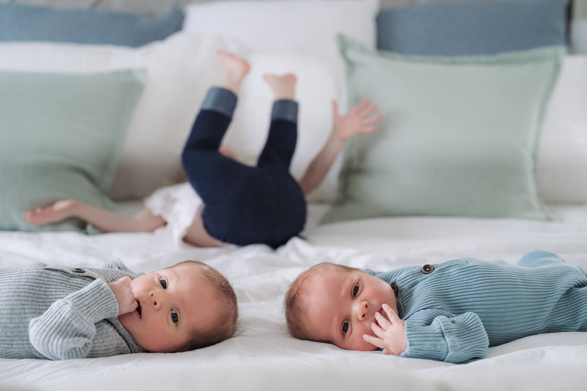 Twin newborns posing for newborn photos