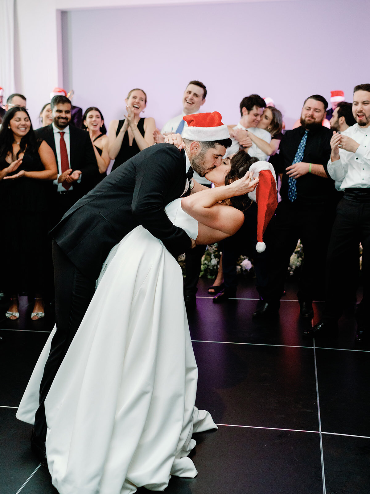 Bride and groom share a kiss on the dance floor at their wedding in Hotel Washington in DC