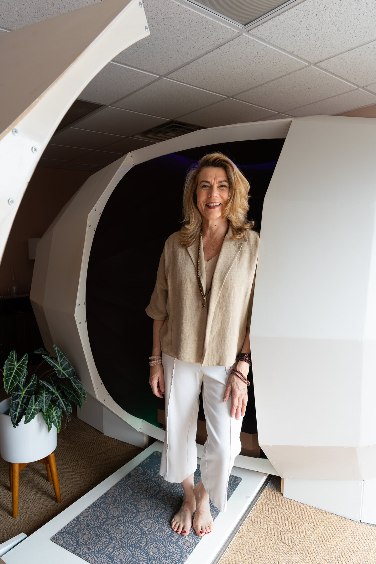 Lisa from Hummingbird Healing Center standing in front of CT's only harmonic egg