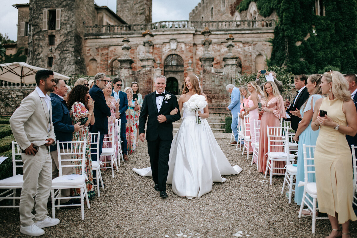 Bride and Father walking down the aisle in a Castle Wedding