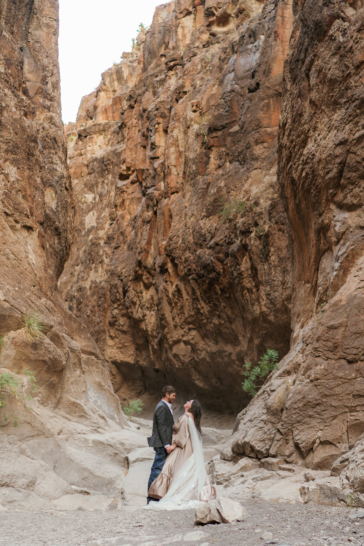 eloping couple in a slot canyon