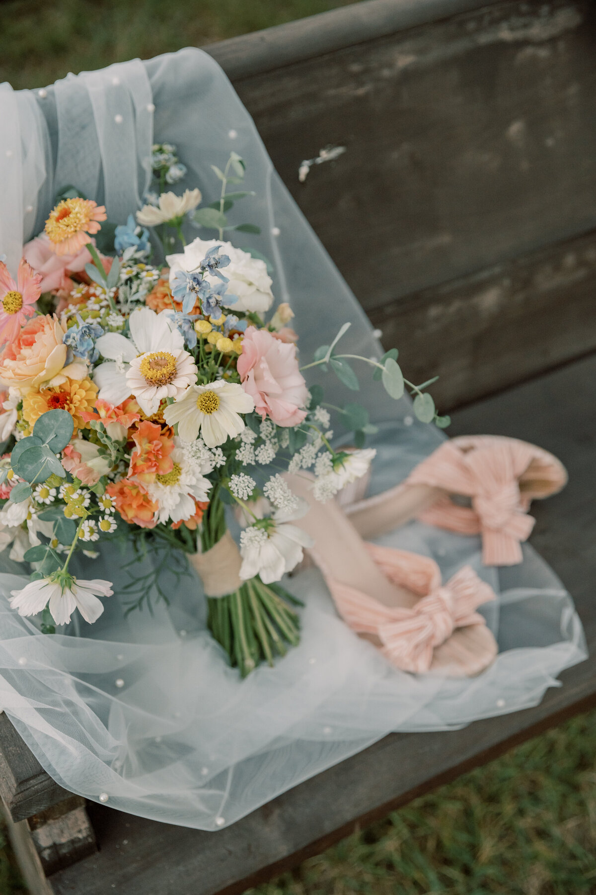 Three Oaks Manor Wedding | bridal bouquet and shoes on a bench