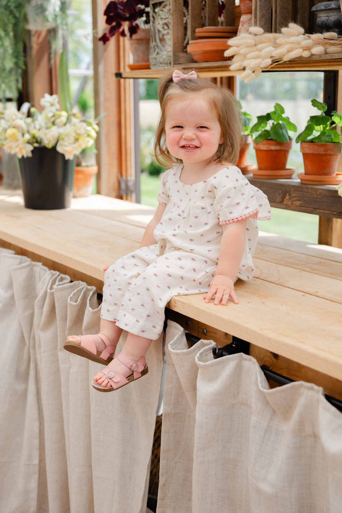 toddler-smiling-greenhouse-minis