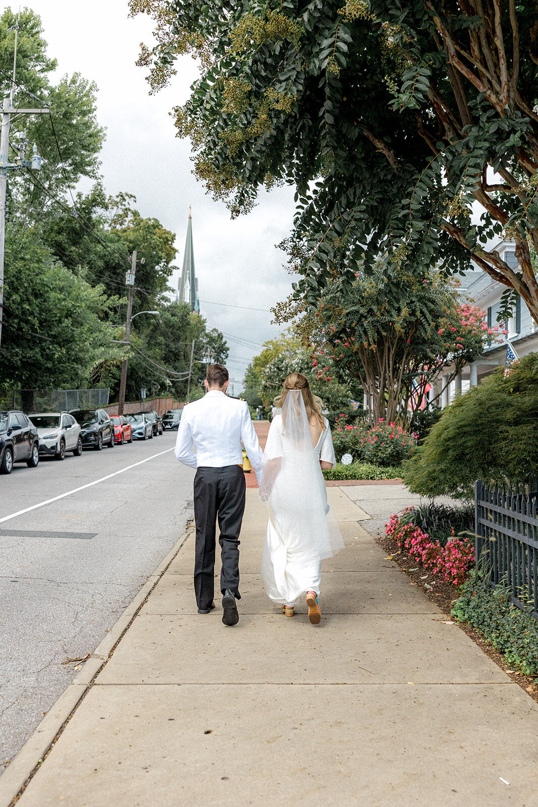 Bride and groom walking away from the camera