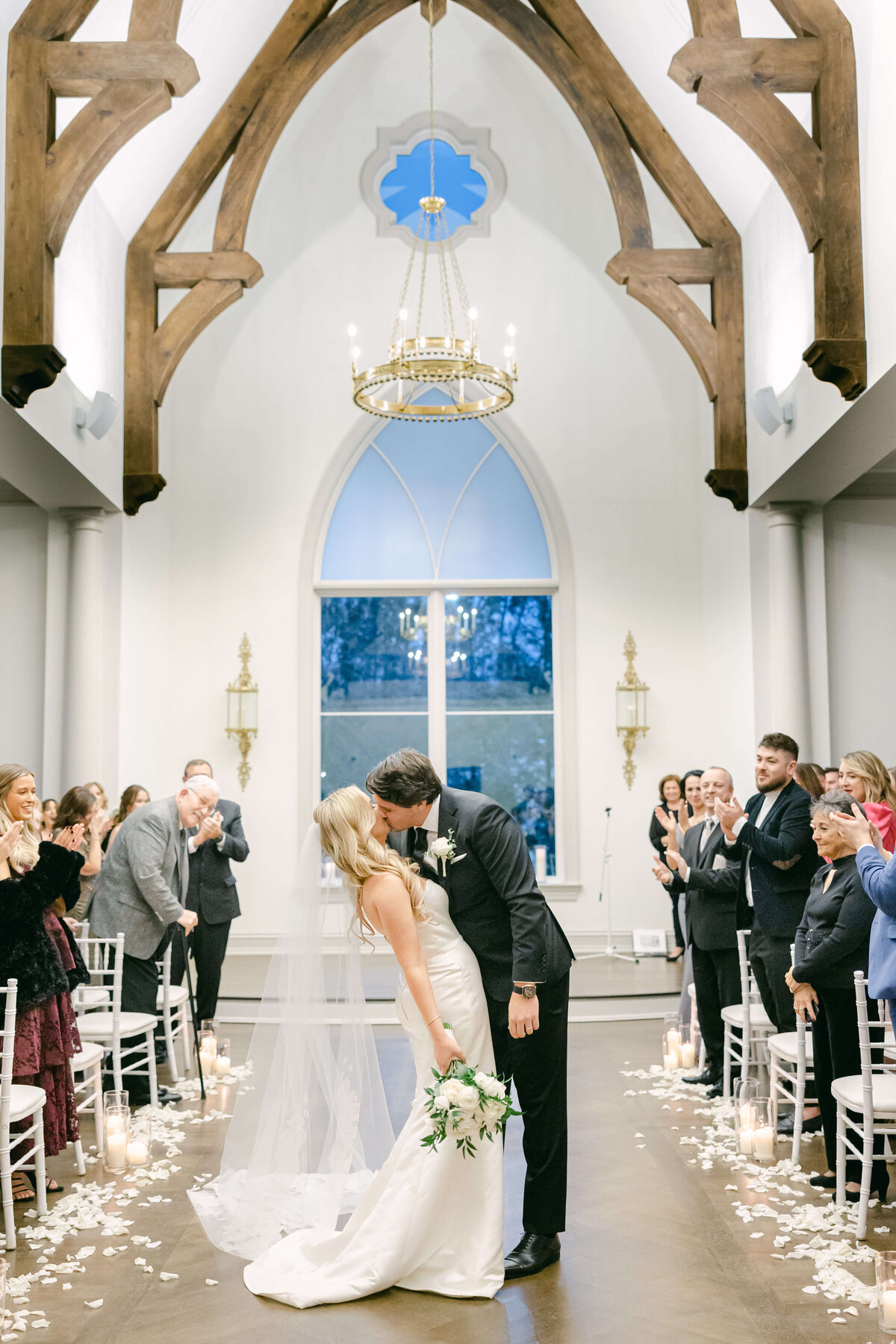 bride and groom walking down the aisle at park chateau chapel