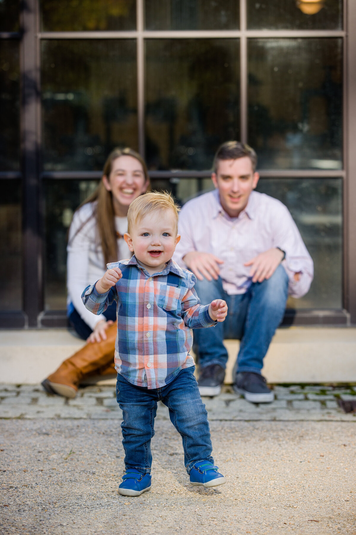 A family enjoying heartfelt laughter, captured during a casual and fun-filled mini session near King of Prussia.