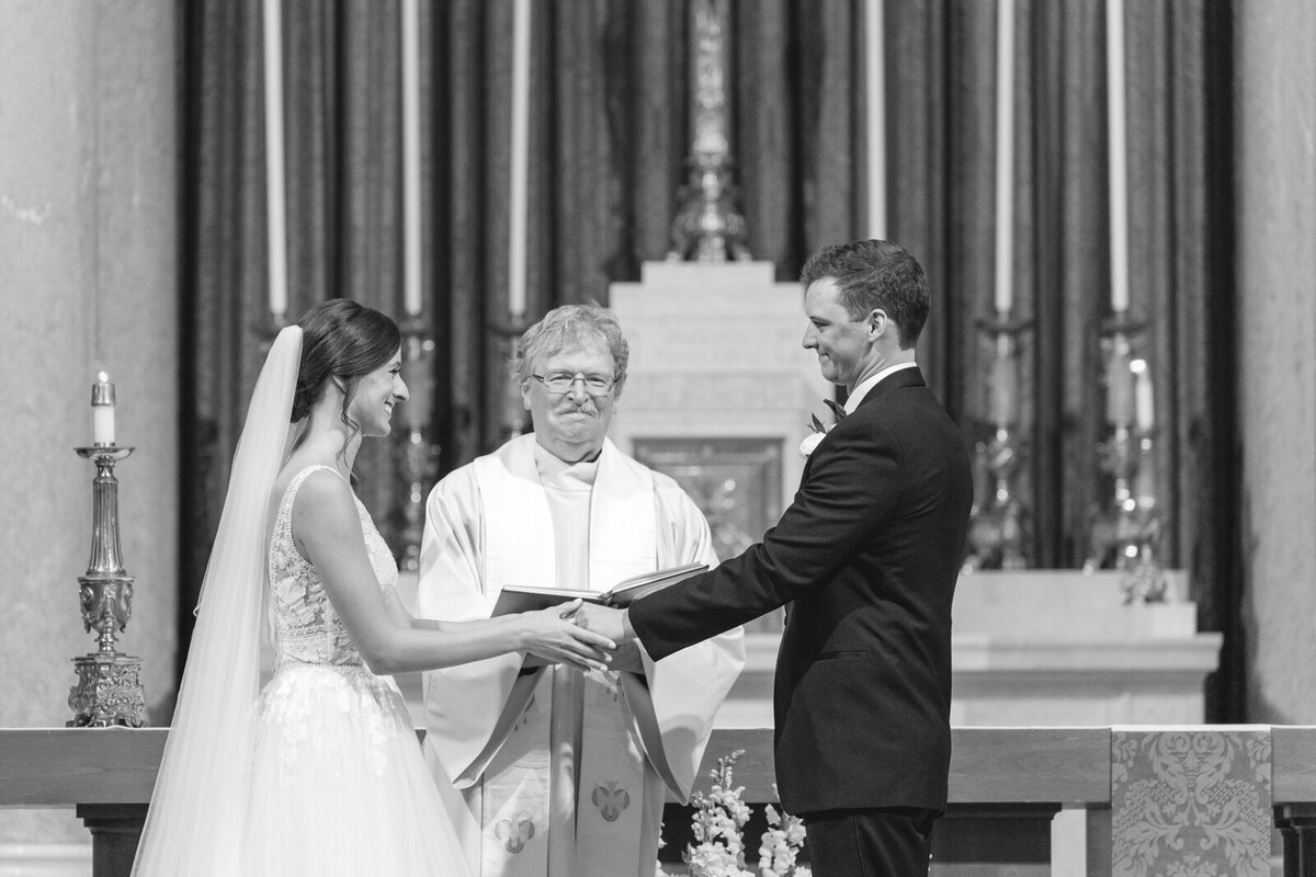 A bride and groom getting married at Hoy Cross
