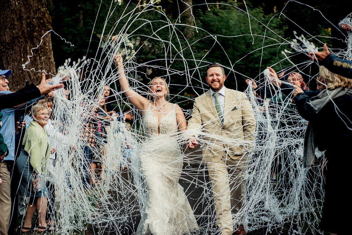 couple exiting with streamers