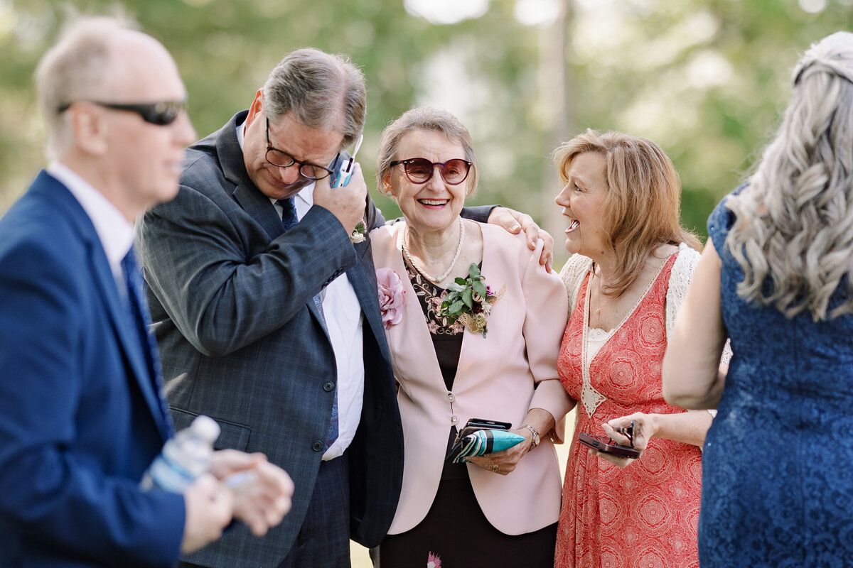 Wedding guests chatting together at Finger Lakes wedding, NY