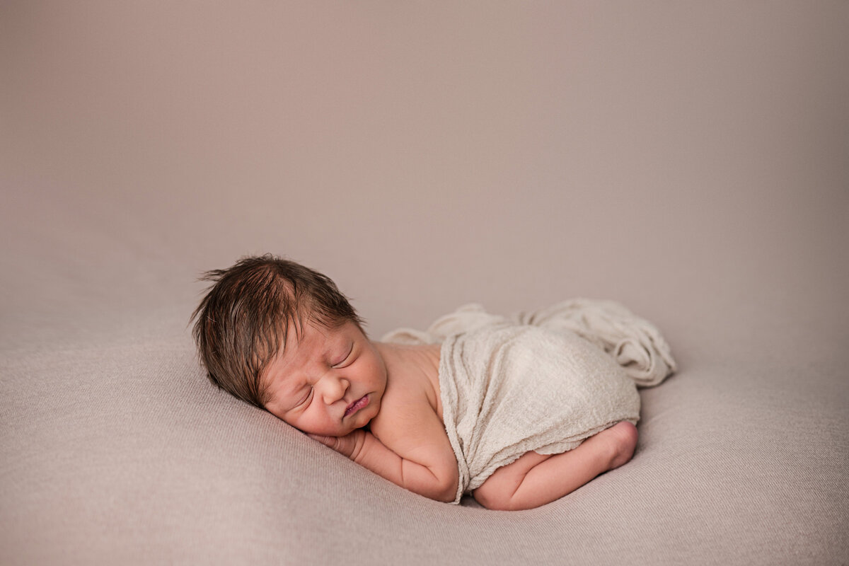 baby with lots of hair in newborn photo