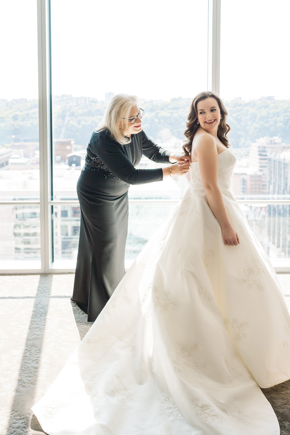 bride getting into her wedding dress during her event at fairmont hotel