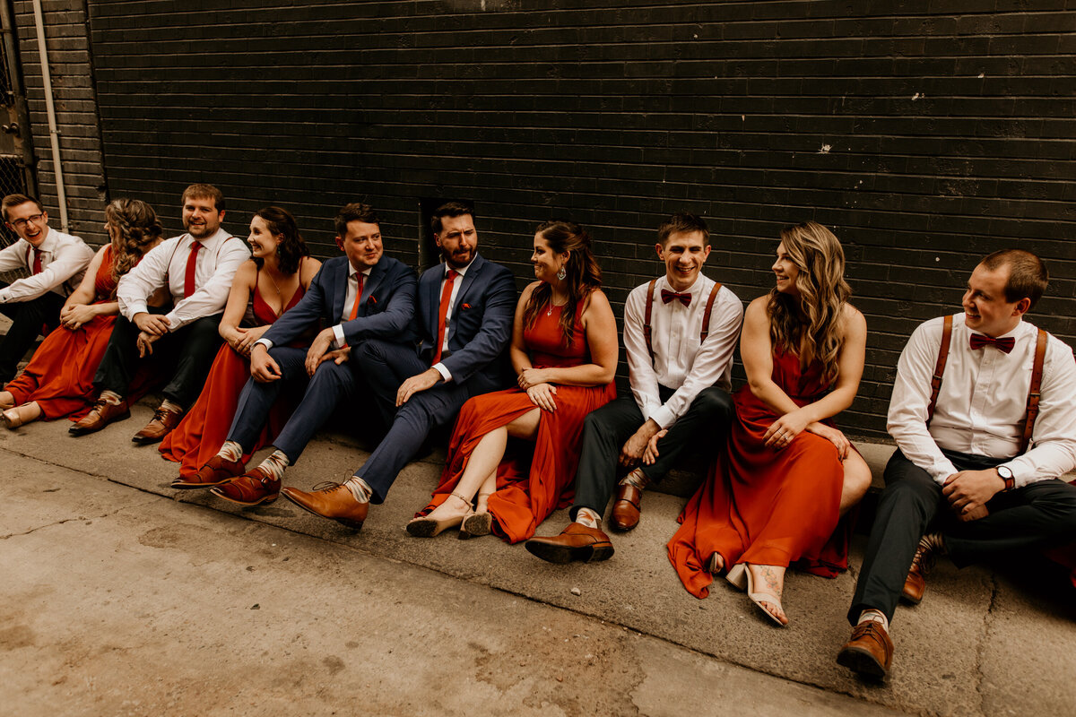 wedding party sitting in an alley in downtown Albuquerque