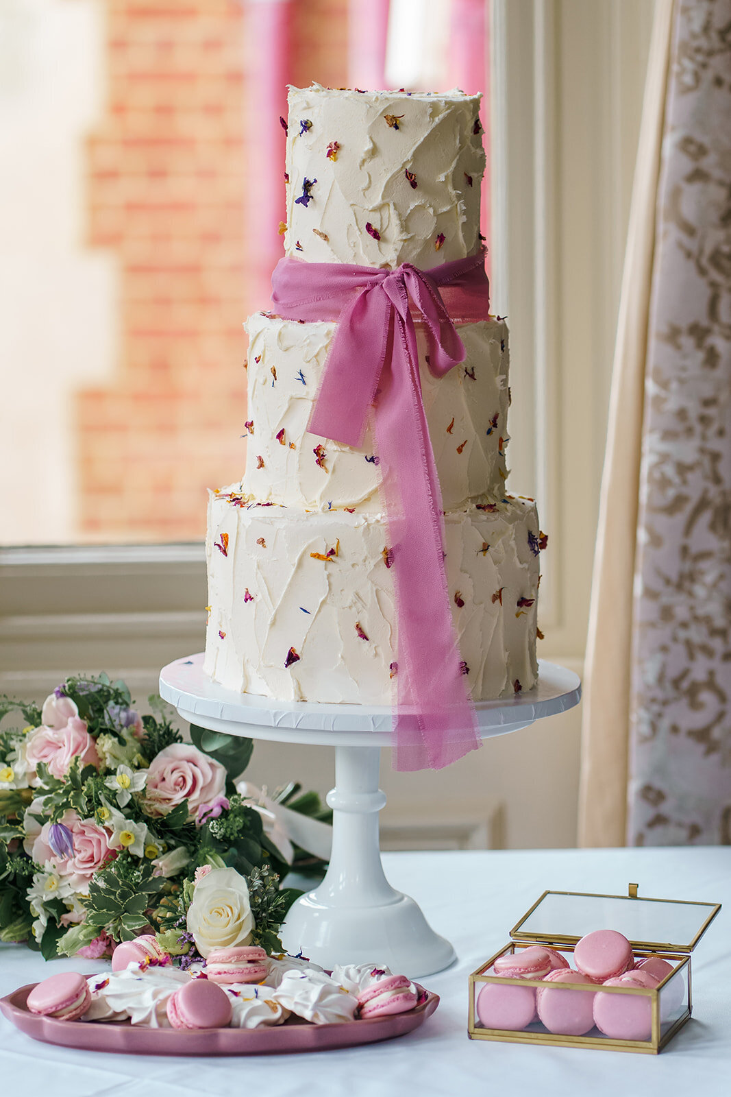 layers-graces-three-tier-wedding-cake-buttercream-edible-petals-bow-pink-fresh-flowers