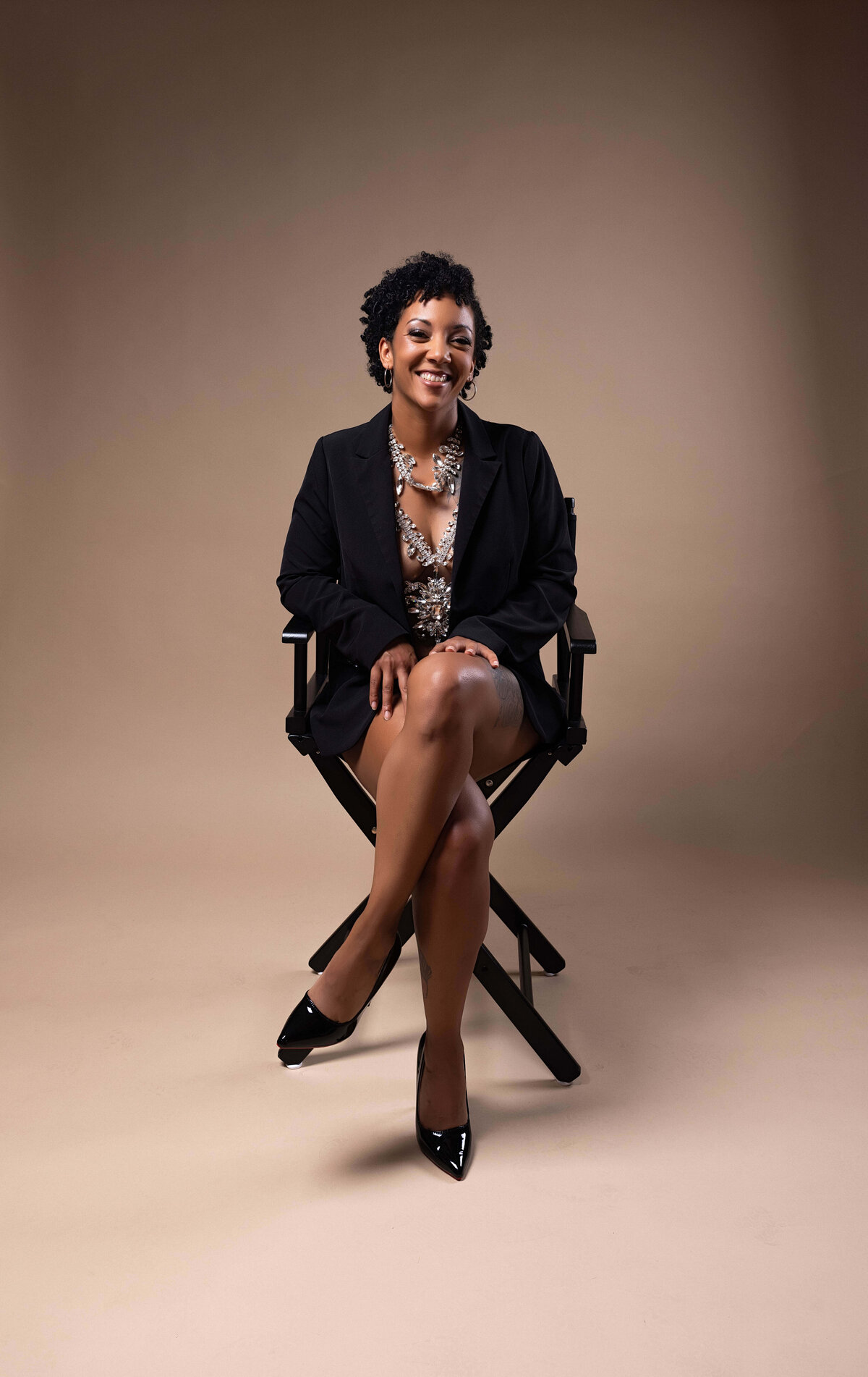 Woman sitting in chair for birthday session with Reva Davis photography