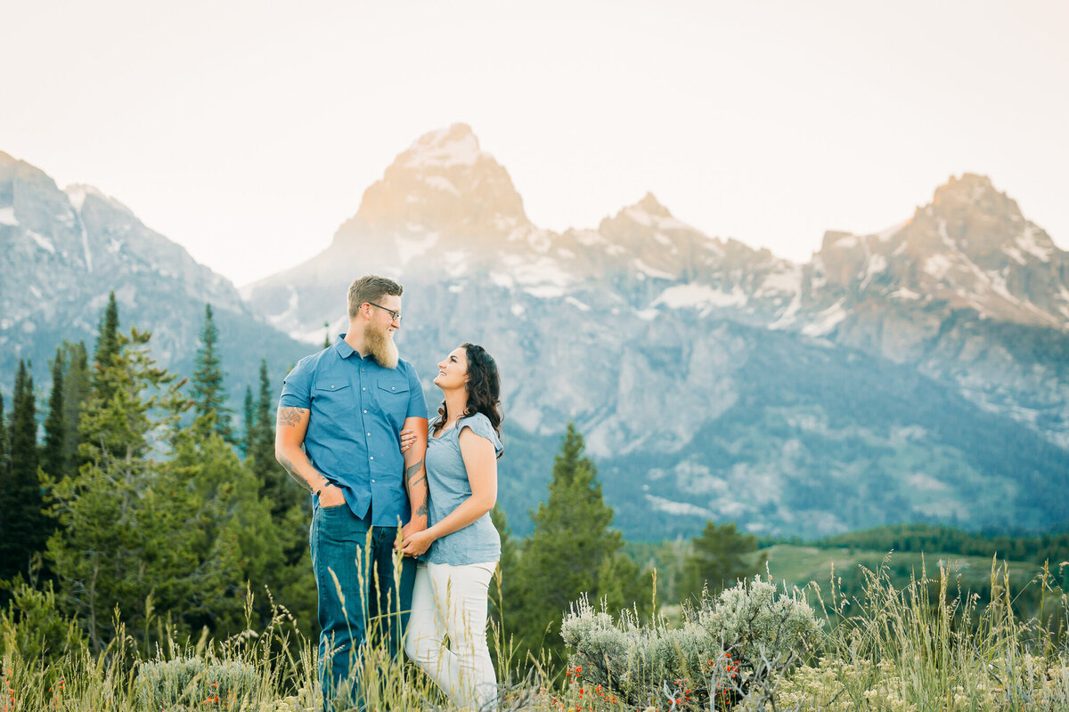 Classic Grand Teton Engagement Photo with blue teton mountains in background