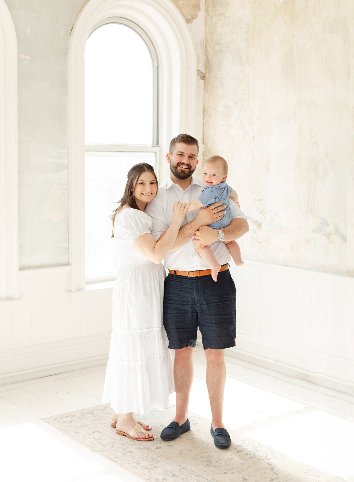 smiling family of three pose for boston photos