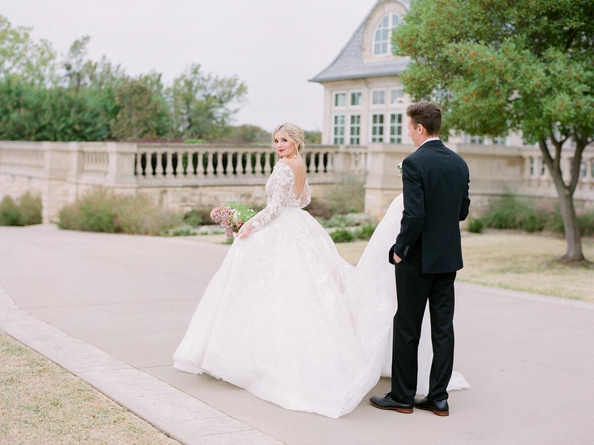 Groom-and-bride-walking-outside-The-Olana-in-Dallas-Texas.jpg