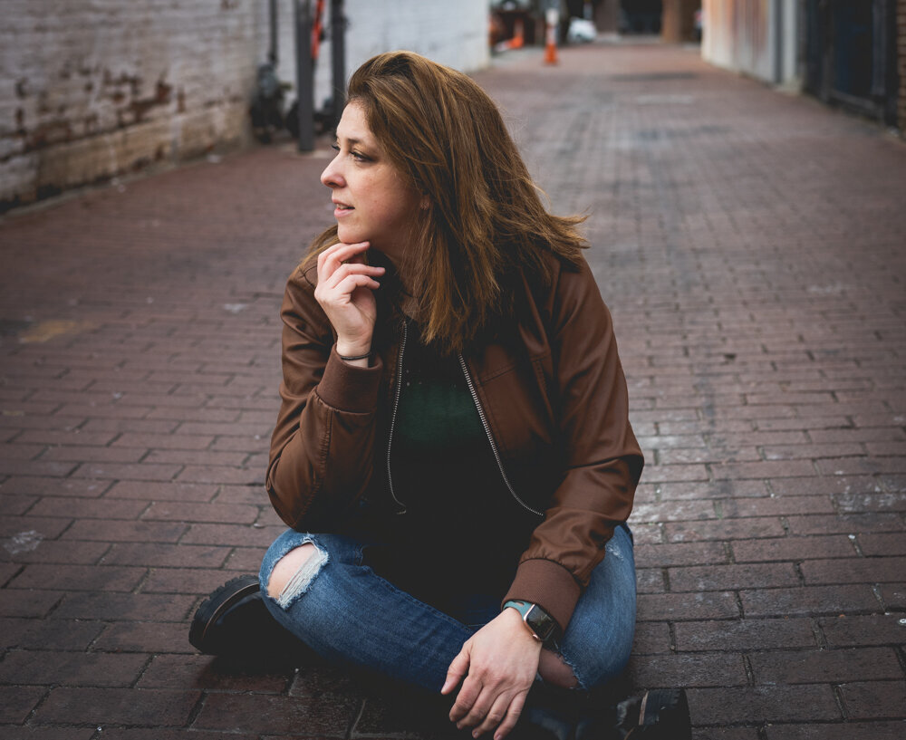 Photo of a woman sitting in Blagden Alley