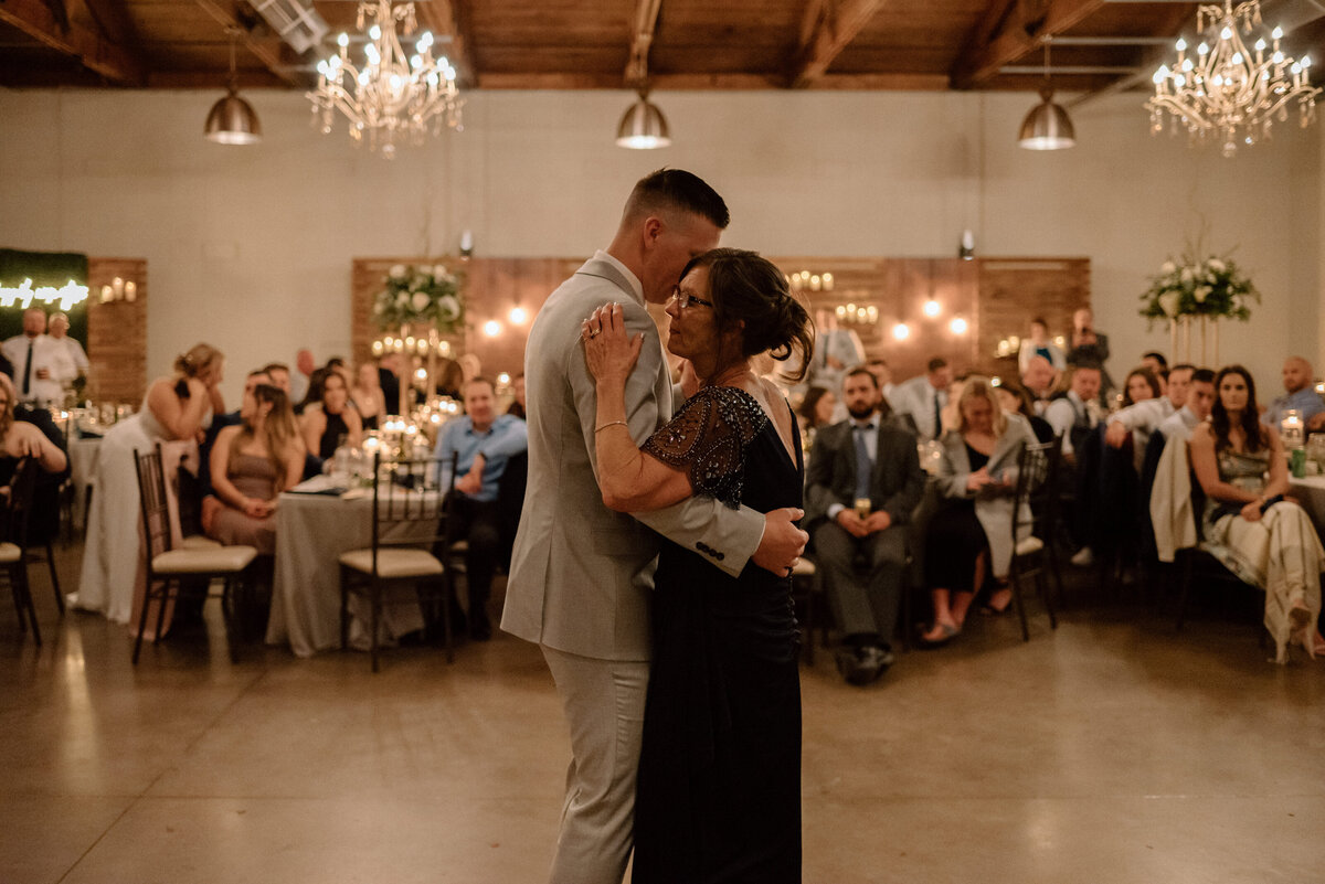 mother of the groom dancing with her son