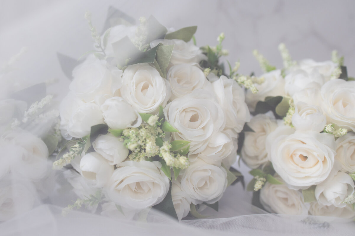 Bridal bouquets covered in veil