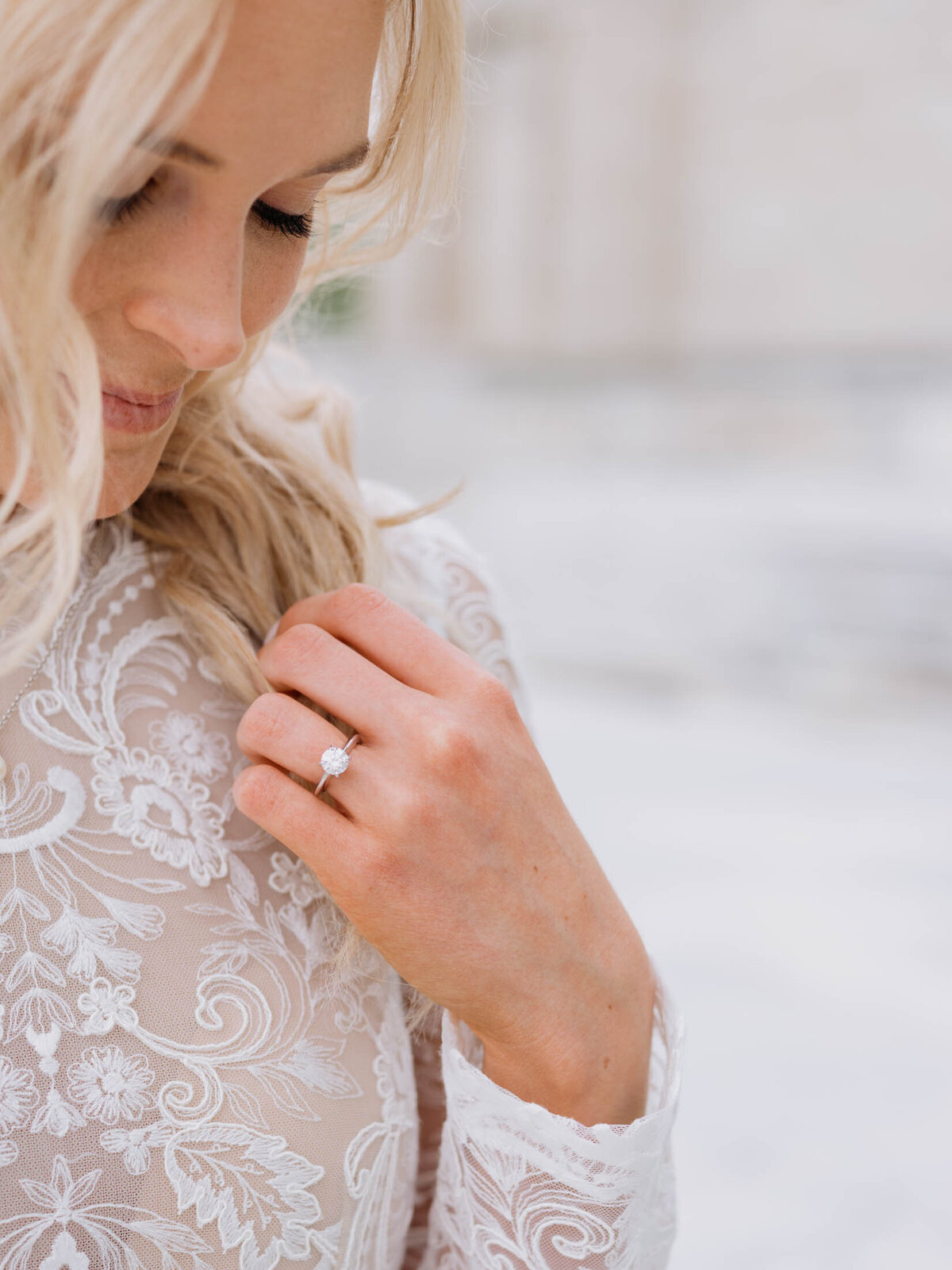 Bride admiring her engagement ring during her Cleveland Art Museum engagement session.