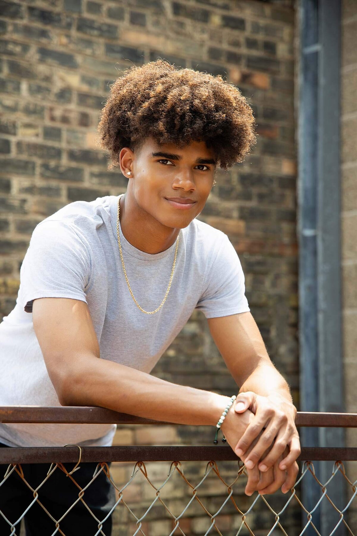 senior-guy-resting-arms-on-railing