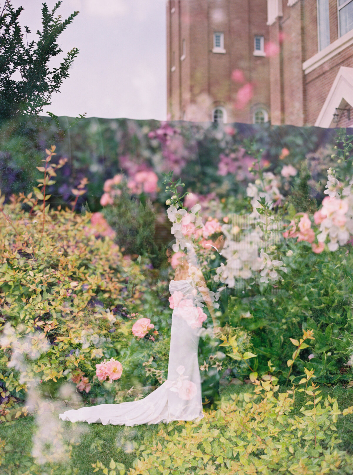 A tender, intimate moment as the bride and groom share their first touch before the ceremony, beautifully documented on film by Morgan Alysse, Louisiana film photographer.