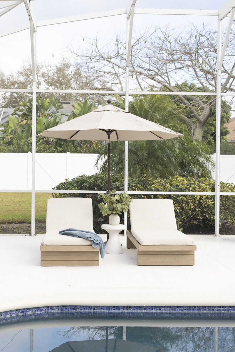 dewine design orlando interior designer belle isle lounge chairs with umbrella by pool